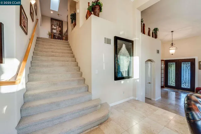 a bed room with a bed and a refrigerator