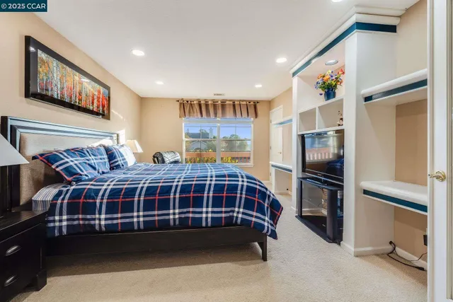 a white toilet sitting next to a bath tub shower