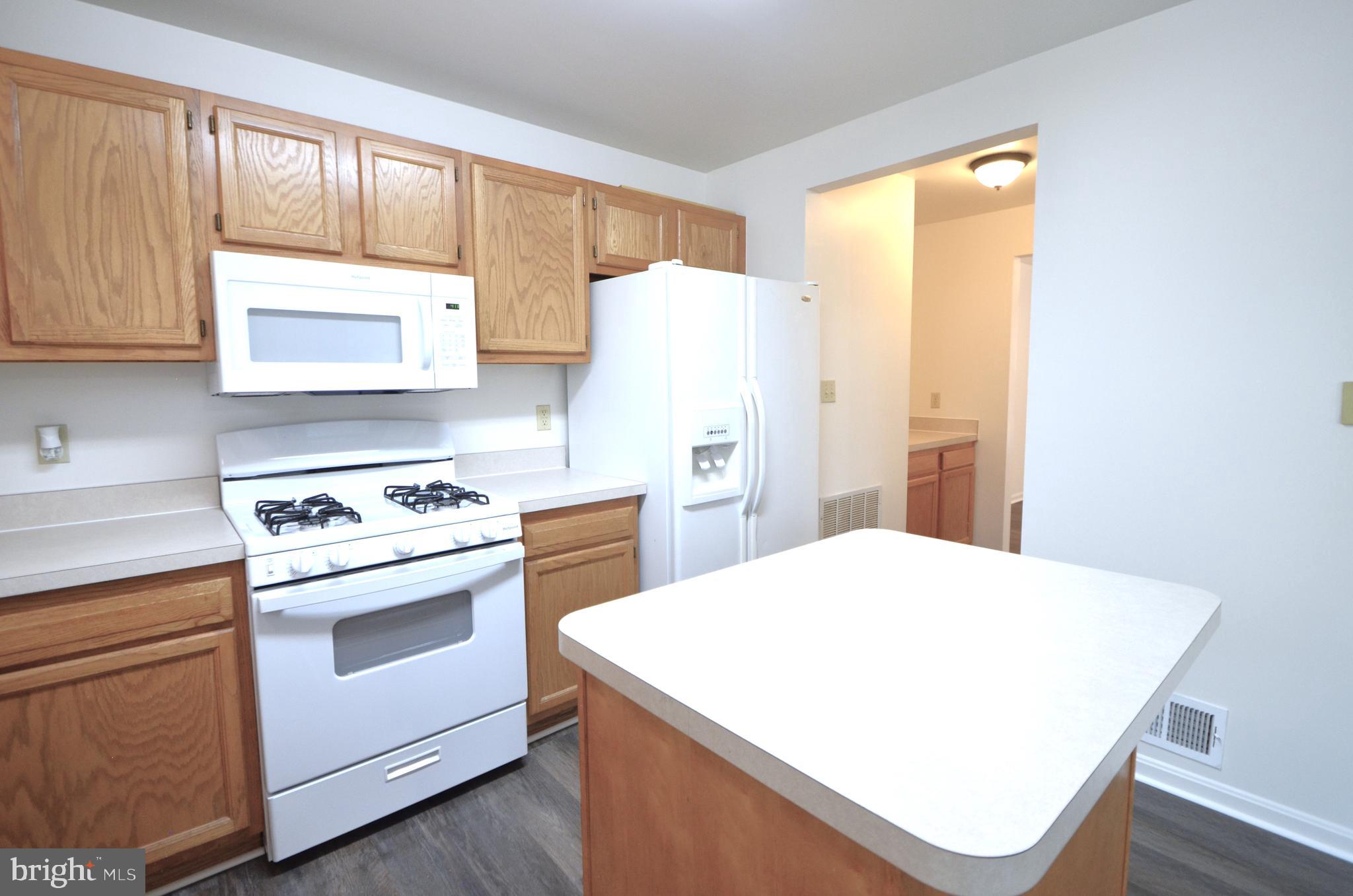 4 Ridge Road Southeast Washington, DC 20019 - Photo 11 of 47 a kitchen with a stove a sink and a refrigerator