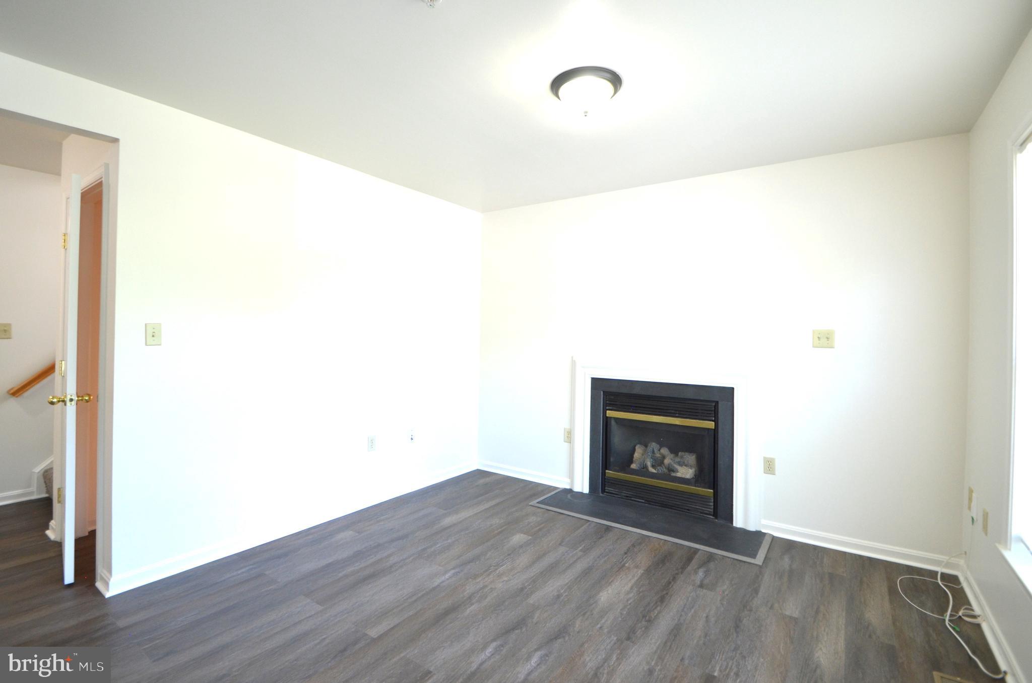 4 Ridge Road Southeast Washington, DC 20019 - Photo 16 of 47 a room with a fireplace and wooden floor