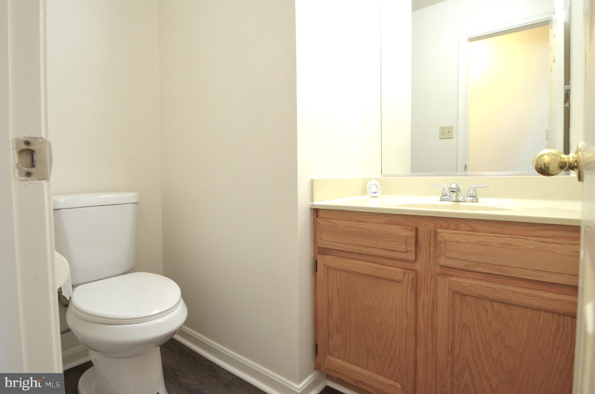 4 Ridge Road Southeast Washington, DC 20019 - Photo 20 of 47 a bathroom with a sink a toilet and a mirror