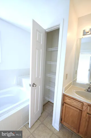 a bathroom with a bathtub and a sink