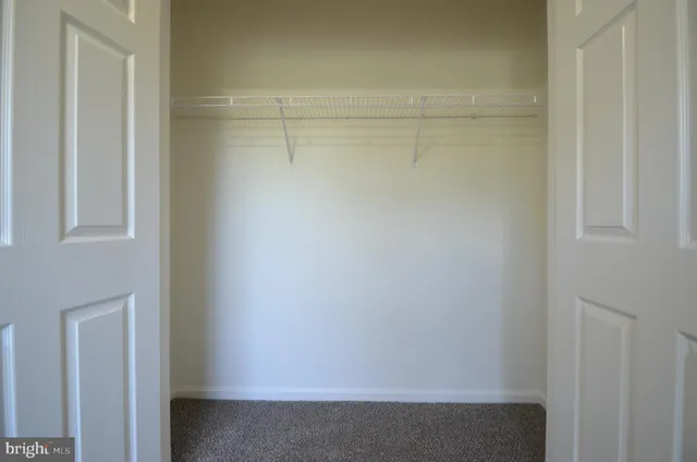 a bathroom with a shower a toilet and a sink