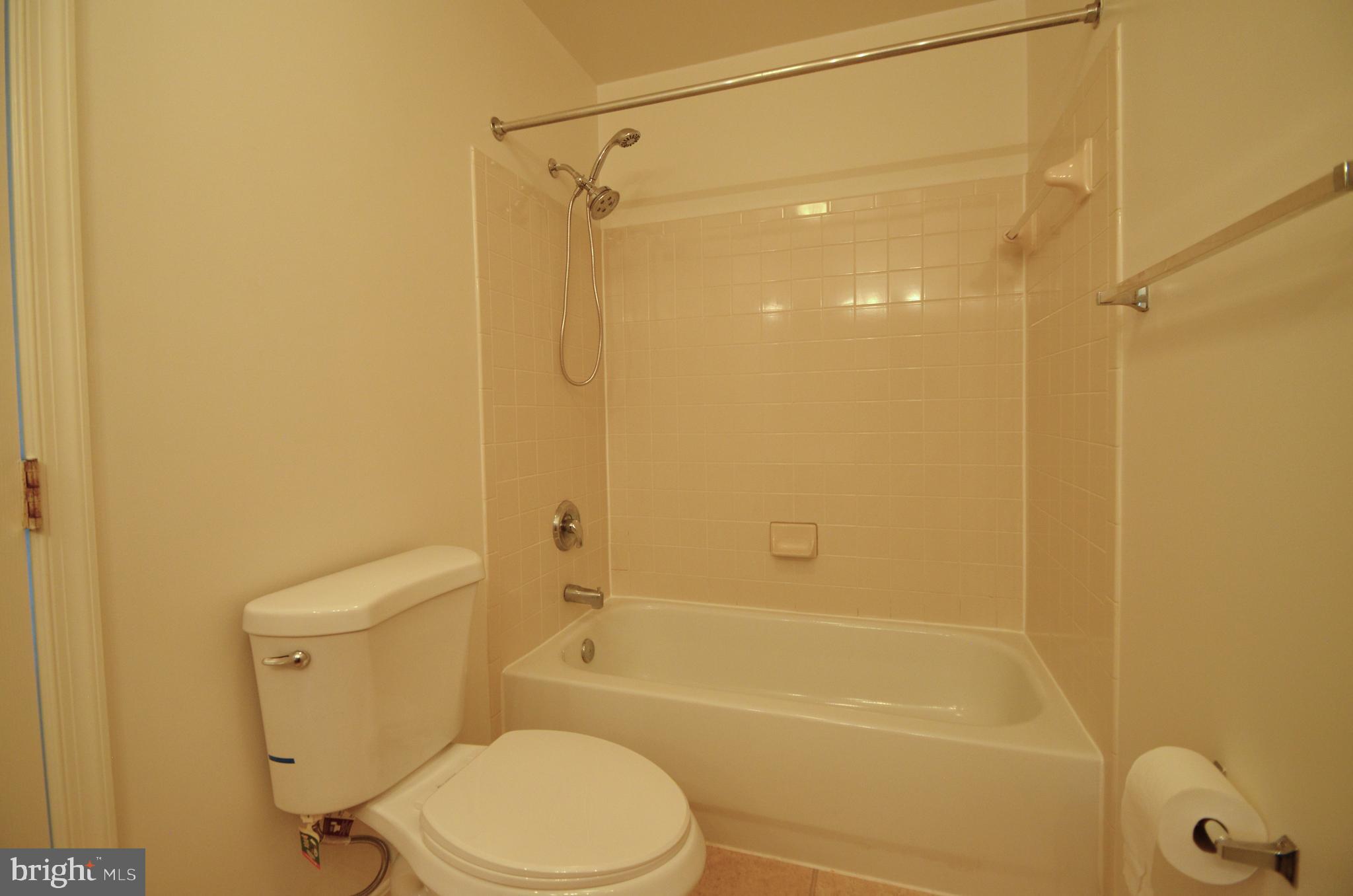 4 Ridge Road Southeast Washington, DC 20019 - Photo 36 of 47 a bathroom with a shower a toilet and a sink