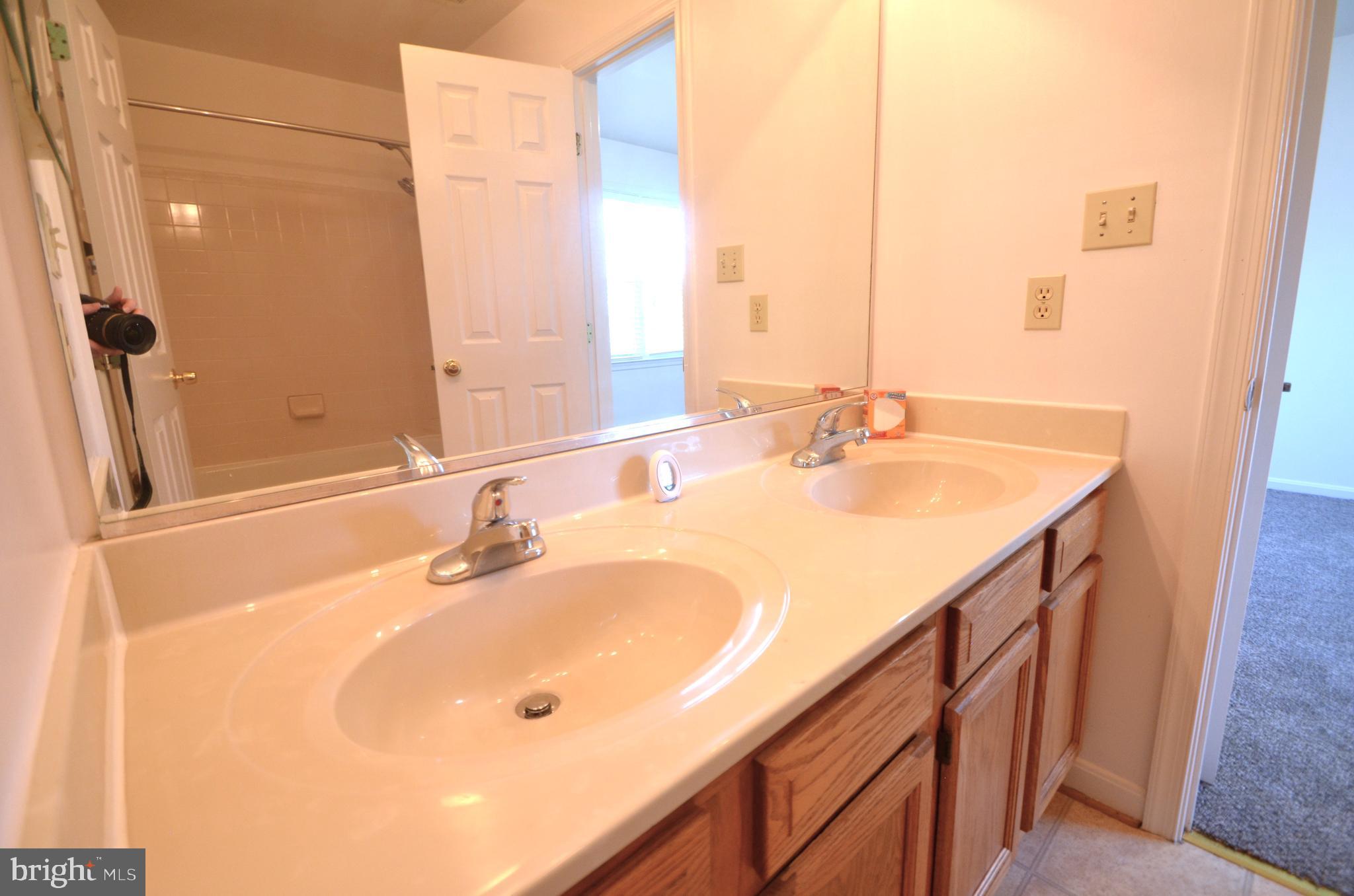 4 Ridge Road Southeast Washington, DC 20019 - Photo 38 of 47 a bathroom with a sink and a mirror