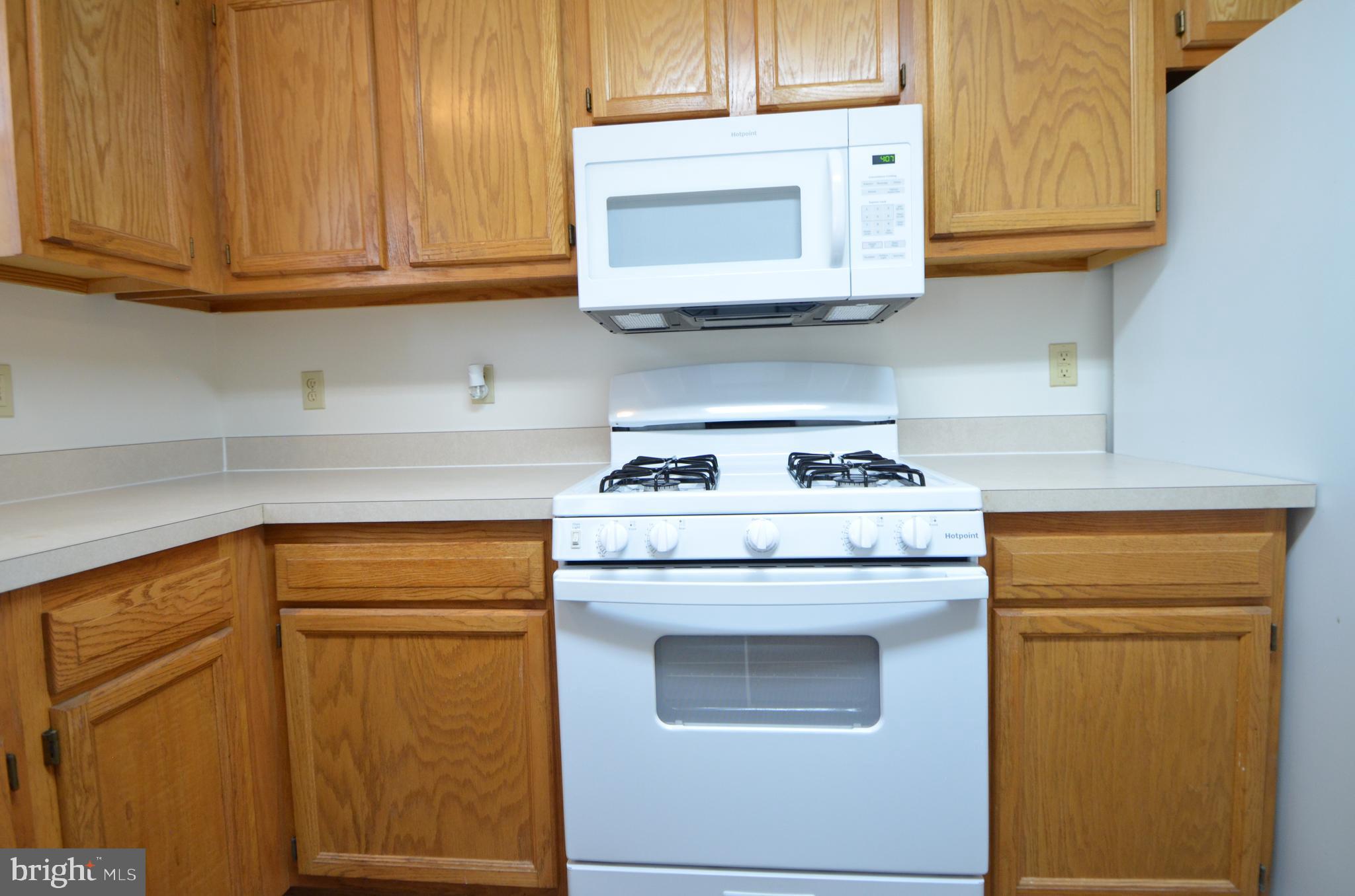 4 Ridge Road Southeast Washington, DC 20019 - Photo 10 of 47 a kitchen with stainless steel appliances granite countertop cabinets and a refrigerator