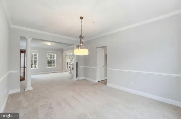 a kitchen with kitchen island granite countertop a sink appliances and cabinets