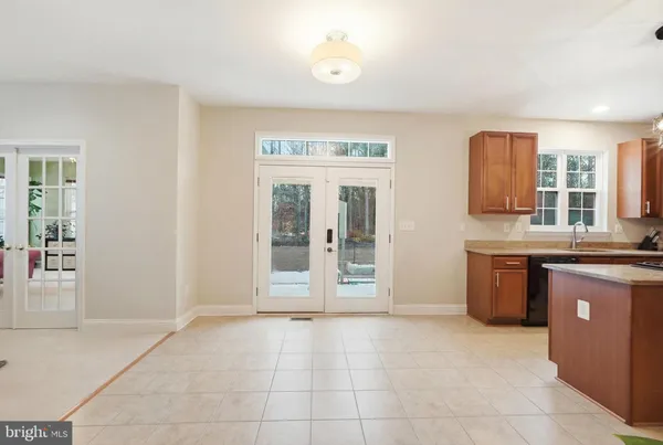 a view of a hallway with washer and dryer