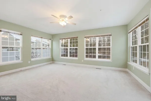 a view of a hallway with a window and stairs