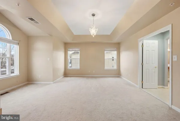 a spacious bathroom with sink shower bathtub and window