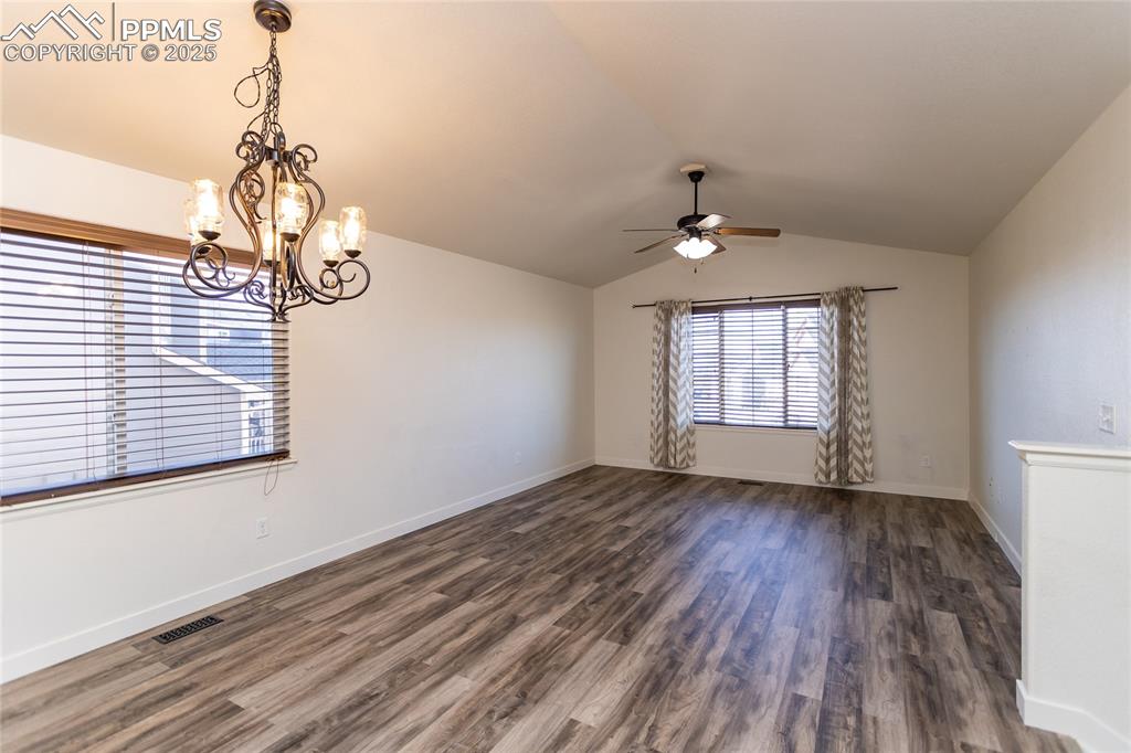 6806 Red Cardinal Loop Colorado Springs, CO 80908 - Photo 11 of 32 a view of an empty room with wooden floor and a window