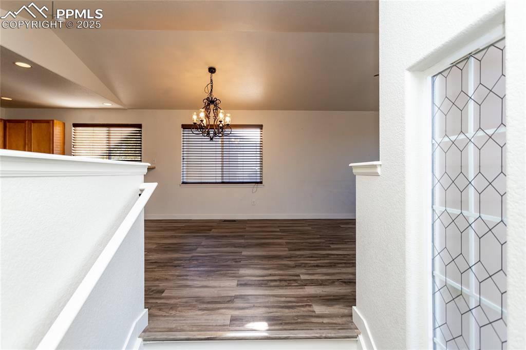 6806 Red Cardinal Loop Colorado Springs, CO 80908 - Photo 12 of 32 a view of a kitchen with a sink and a refrigerator