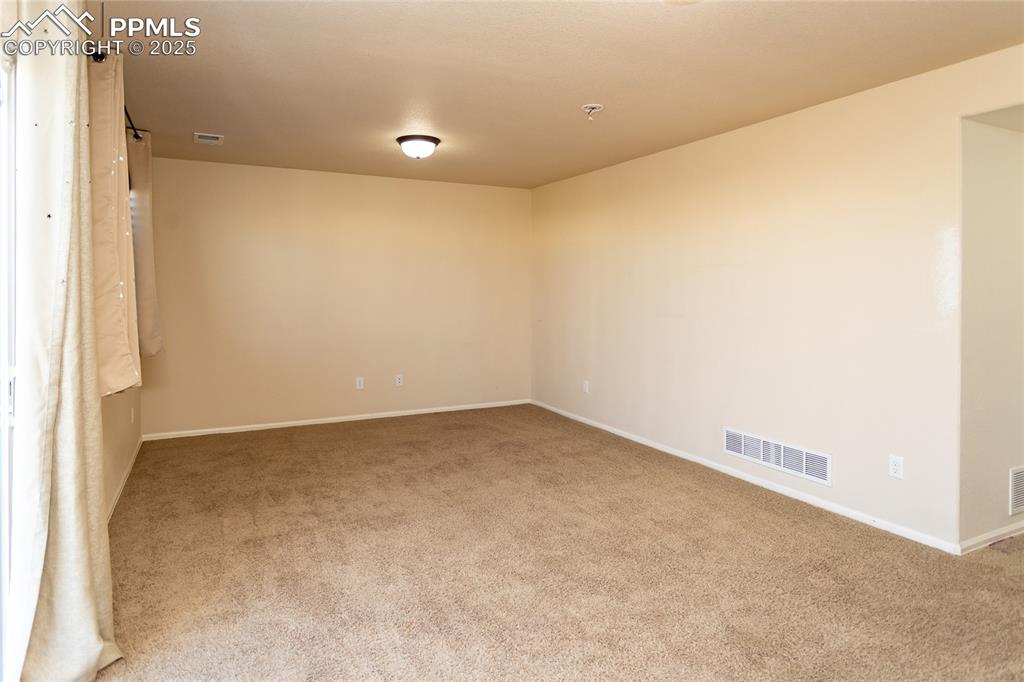 6806 Red Cardinal Loop Colorado Springs, CO 80908 - Photo 16 of 32 an empty room with a projector