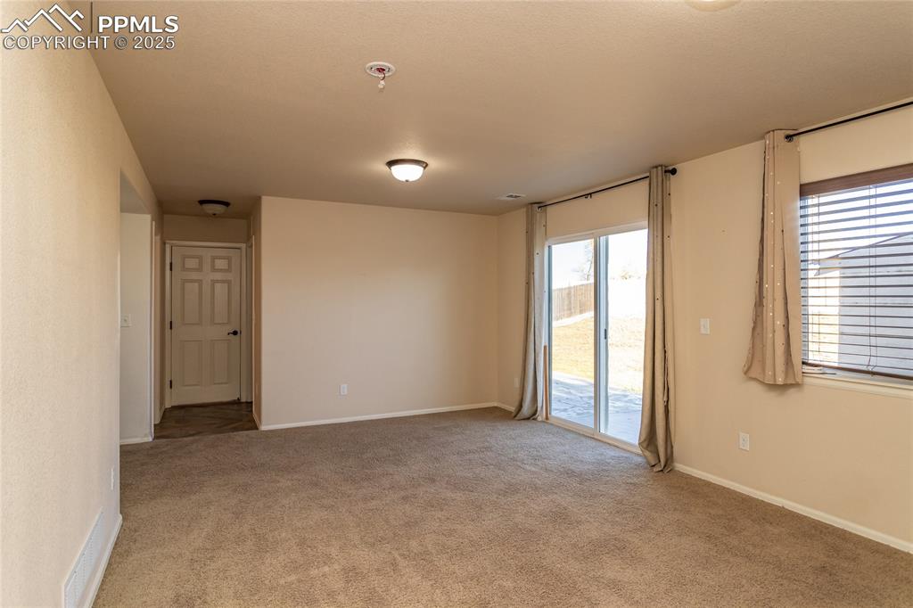6806 Red Cardinal Loop Colorado Springs, CO 80908 - Photo 18 of 32 a view of an empty room with a window