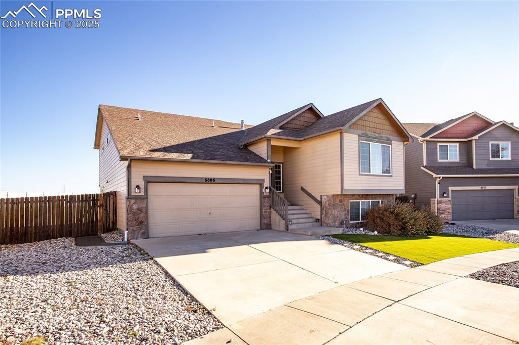 6806 Red Cardinal Loop Colorado Springs, CO 80908 - Photo 2 of 32 a view of a house with swimming pool in front of it