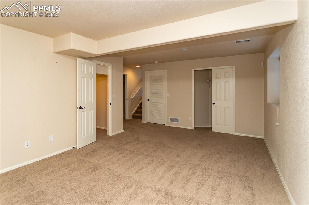6806 Red Cardinal Loop Colorado Springs, CO 80908 - Photo 22 of 32 an empty room with a natural light