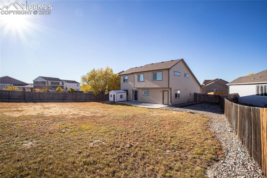 6806 Red Cardinal Loop Colorado Springs, CO 80908 - Photo 3 of 32 a bedroom with a bed and a cabinets