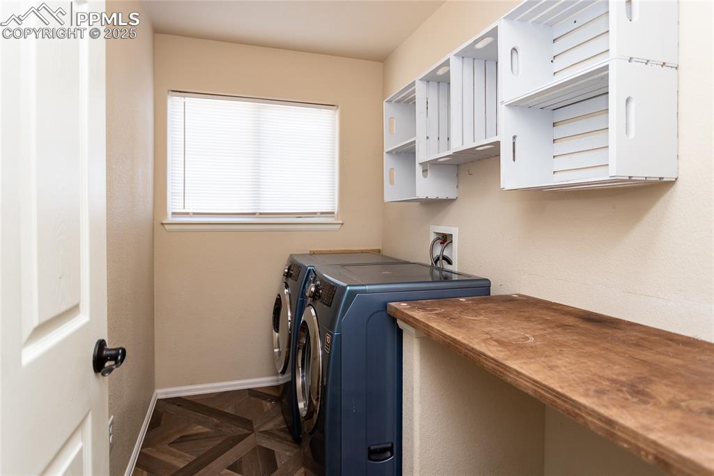 6806 Red Cardinal Loop Colorado Springs, CO 80908 - Photo 31 of 32 a view of a kitchen with a sink cabinets and a window