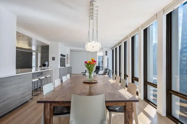 a large white kitchen with a large window