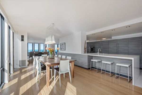 a large white kitchen with a large window