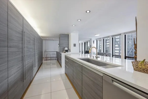 a kitchen with a table and chairs