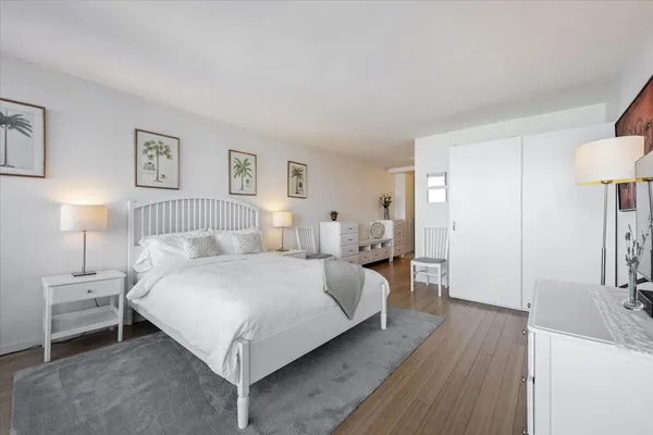a view of hallway with wooden floor