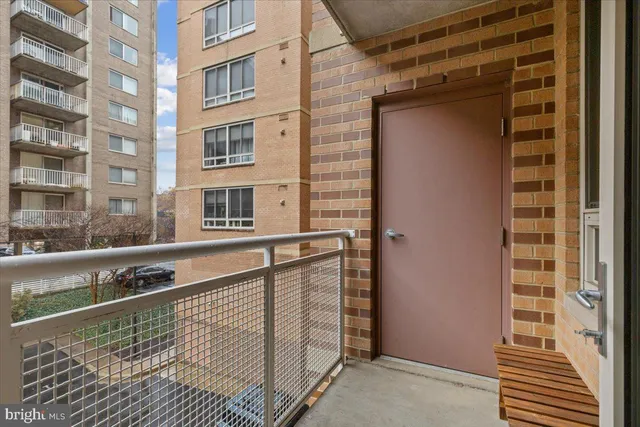 a bedroom with a large bed and a night stand