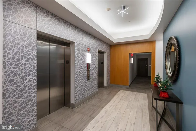 a room with furniture and a chandelier