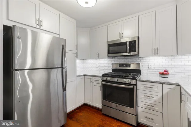 a view of a kitchen from the hallway