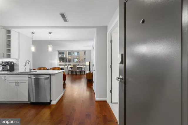 a kitchen with cabinets stainless steel appliances and wooden cabinets