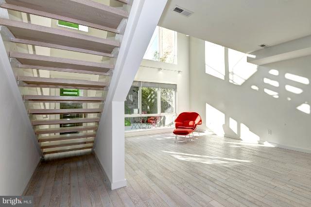 1234 10th Street Northwest, Unit A Washington, DC 20001 - Photo 1 of 17 a view of a room with wooden floor and windows