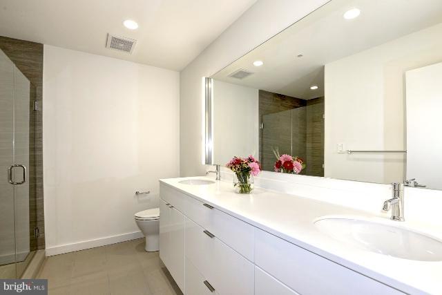 1234 10th Street Northwest, Unit A Washington, DC 20001 - Photo 10 of 17 a bathroom with a sink and a mirror