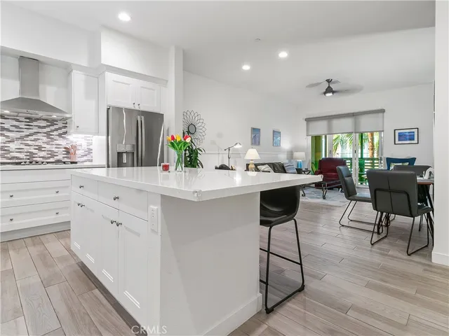 a bedroom with a bed and a wooden floor