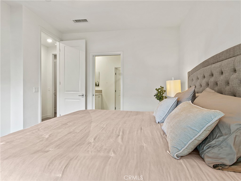 985 Doheny Way Dana Point, CA 92629 - Photo 41 of 53 a bedroom with a bed and a wooden floor