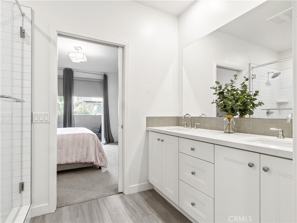 985 Doheny Way Dana Point, CA 92629 - Photo 46 of 53 a en suite bathroom with a double vanity sink and mirror