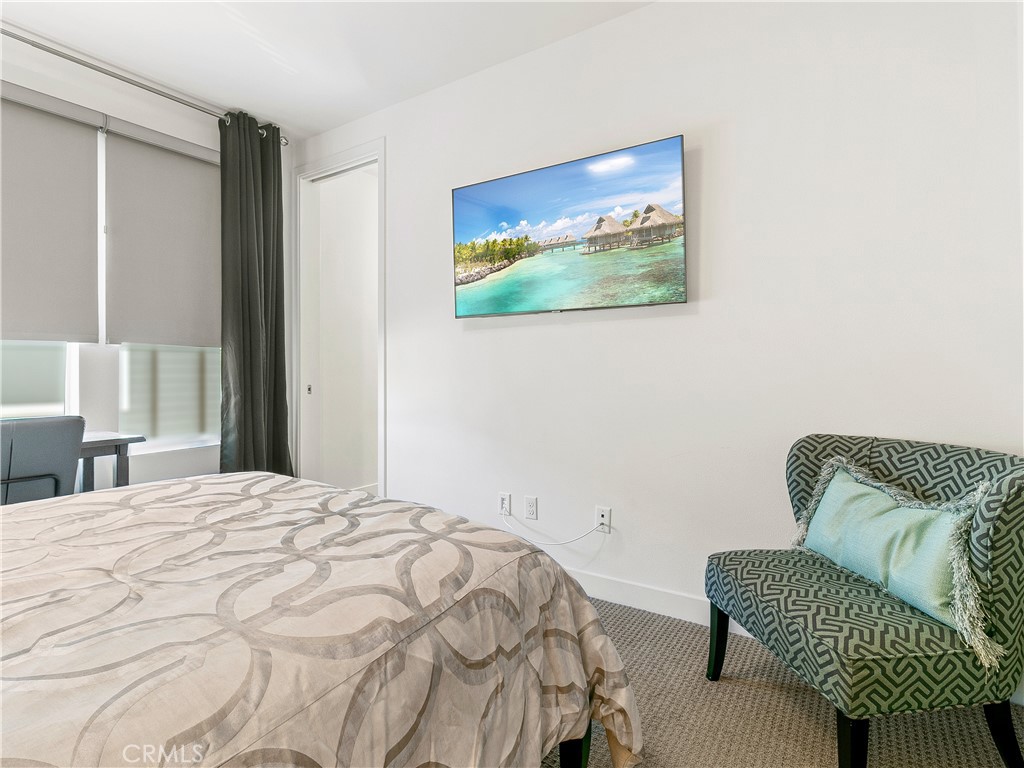 985 Doheny Way Dana Point, CA 92629 - Photo 49 of 53 a bedroom with a bed and a couch