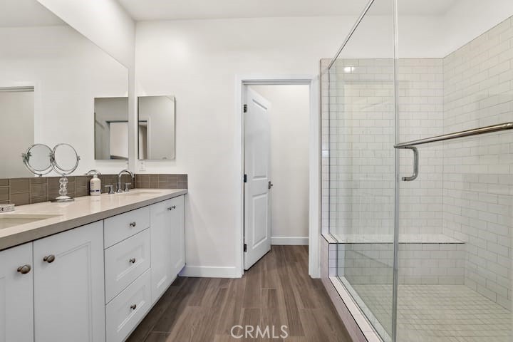 985 Doheny Way Dana Point, CA 92629 - Photo 9 of 53 a bathroom with a double vanity sink and mirror