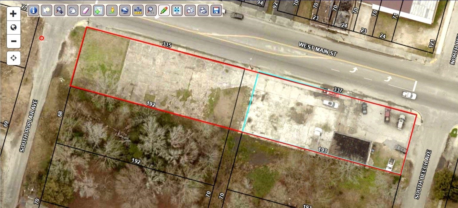 Aerial map of property and surrounding area featuring property parcel outlined