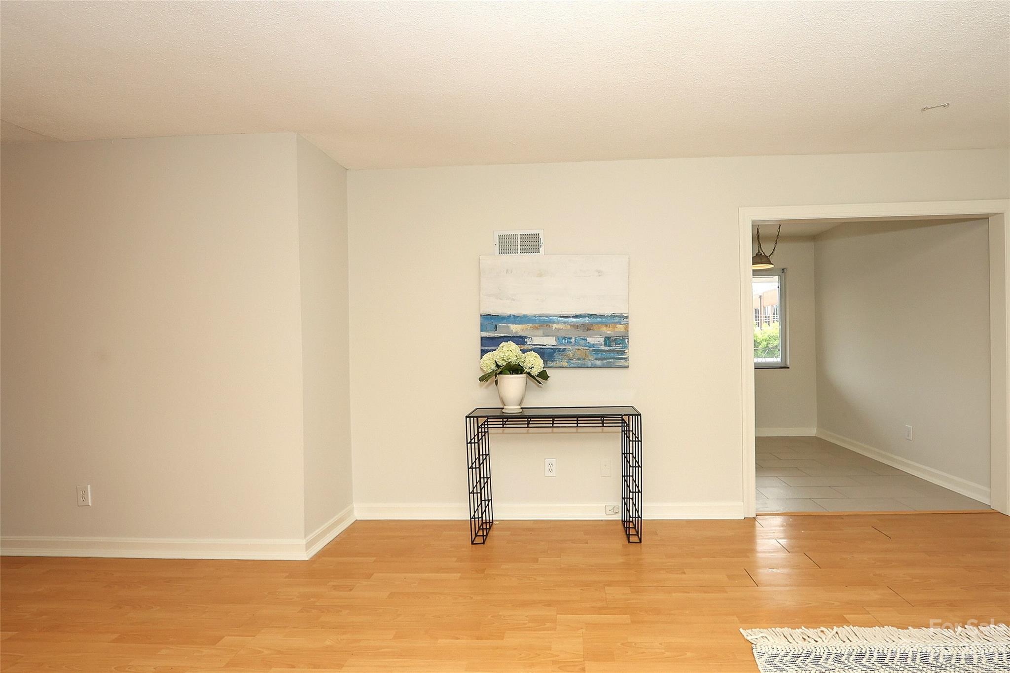 3010 Crosby Road, Unit 220 Charlotte, NC 28211 - Photo 12 of 39 a view of empty room with wooden floor