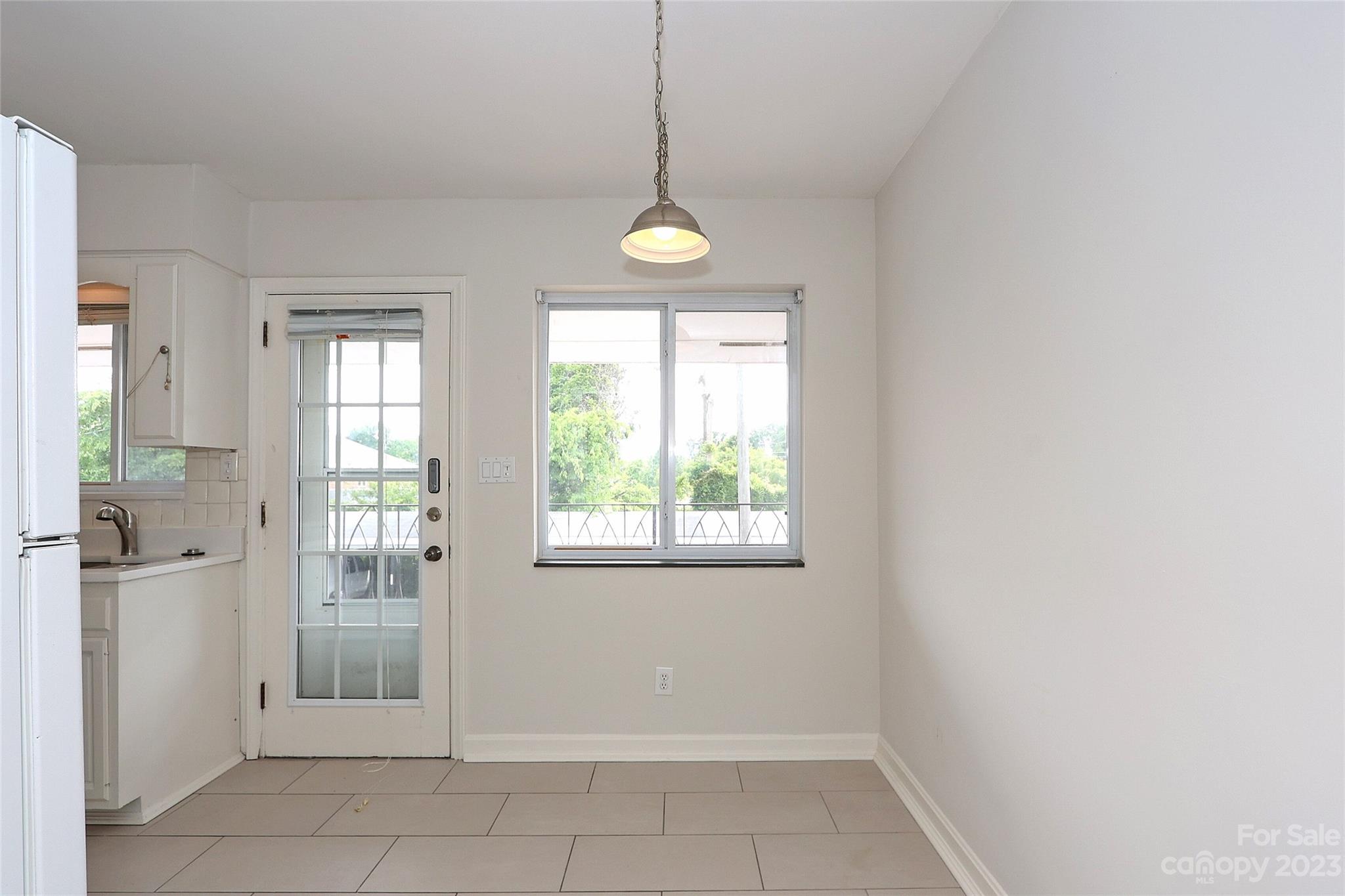 3010 Crosby Road, Unit 220 Charlotte, NC 28211 - Photo 13 of 39 a view of a room with wooden floor and windows