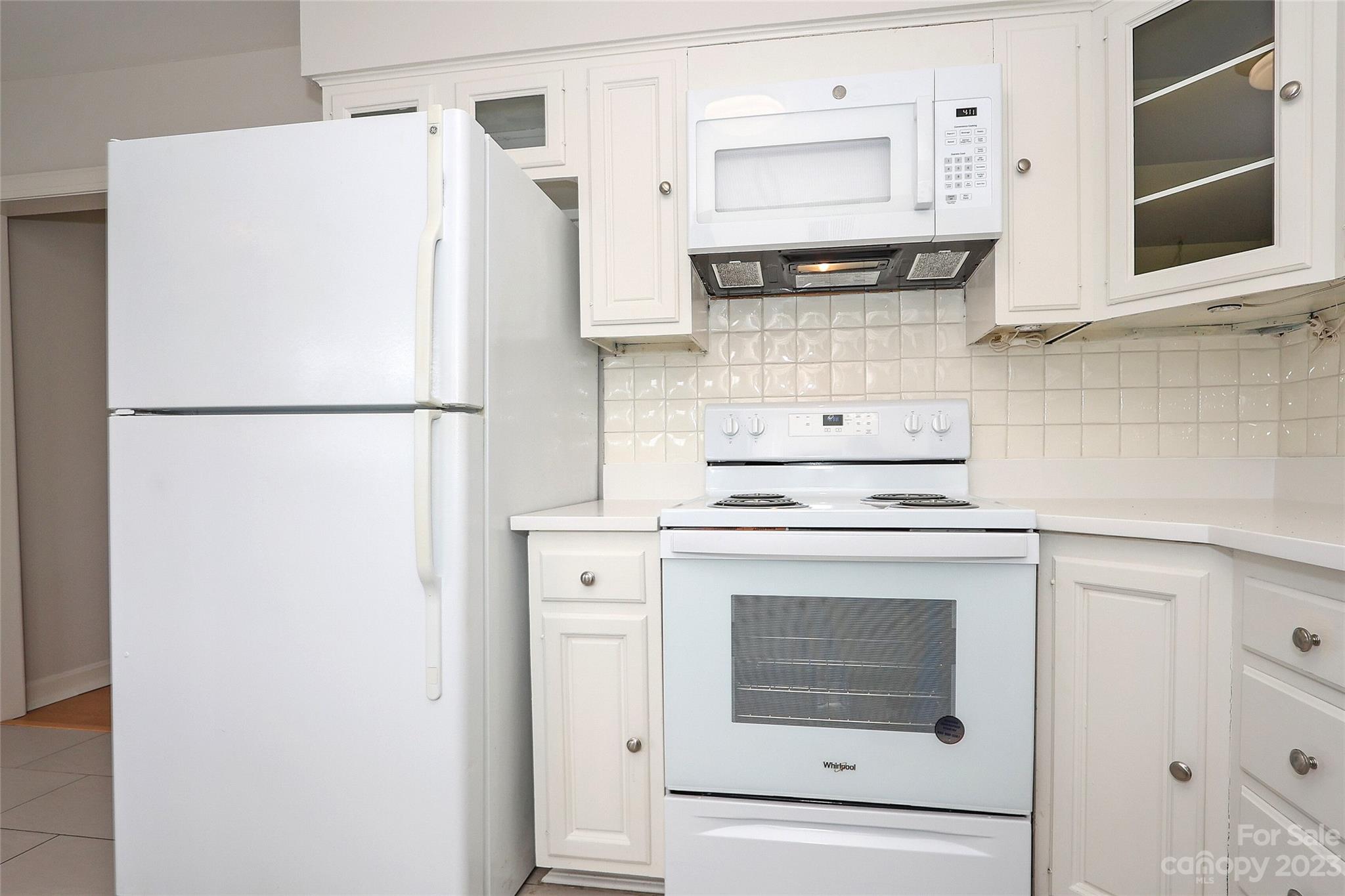 3010 Crosby Road, Unit 220 Charlotte, NC 28211 - Photo 18 of 39 a white refrigerator freezer sitting inside of a kitchen