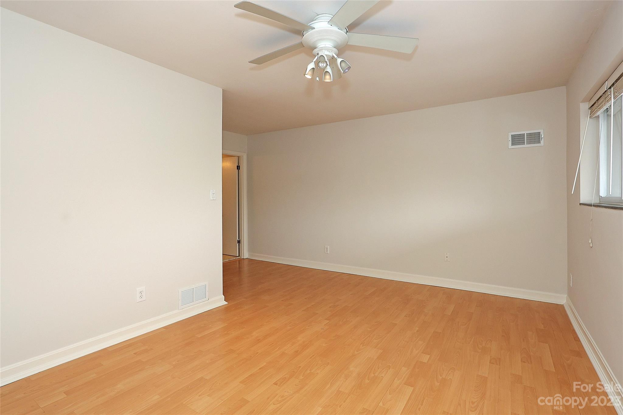 3010 Crosby Road, Unit 220 Charlotte, NC 28211 - Photo 20 of 39 an empty room with windows and fan