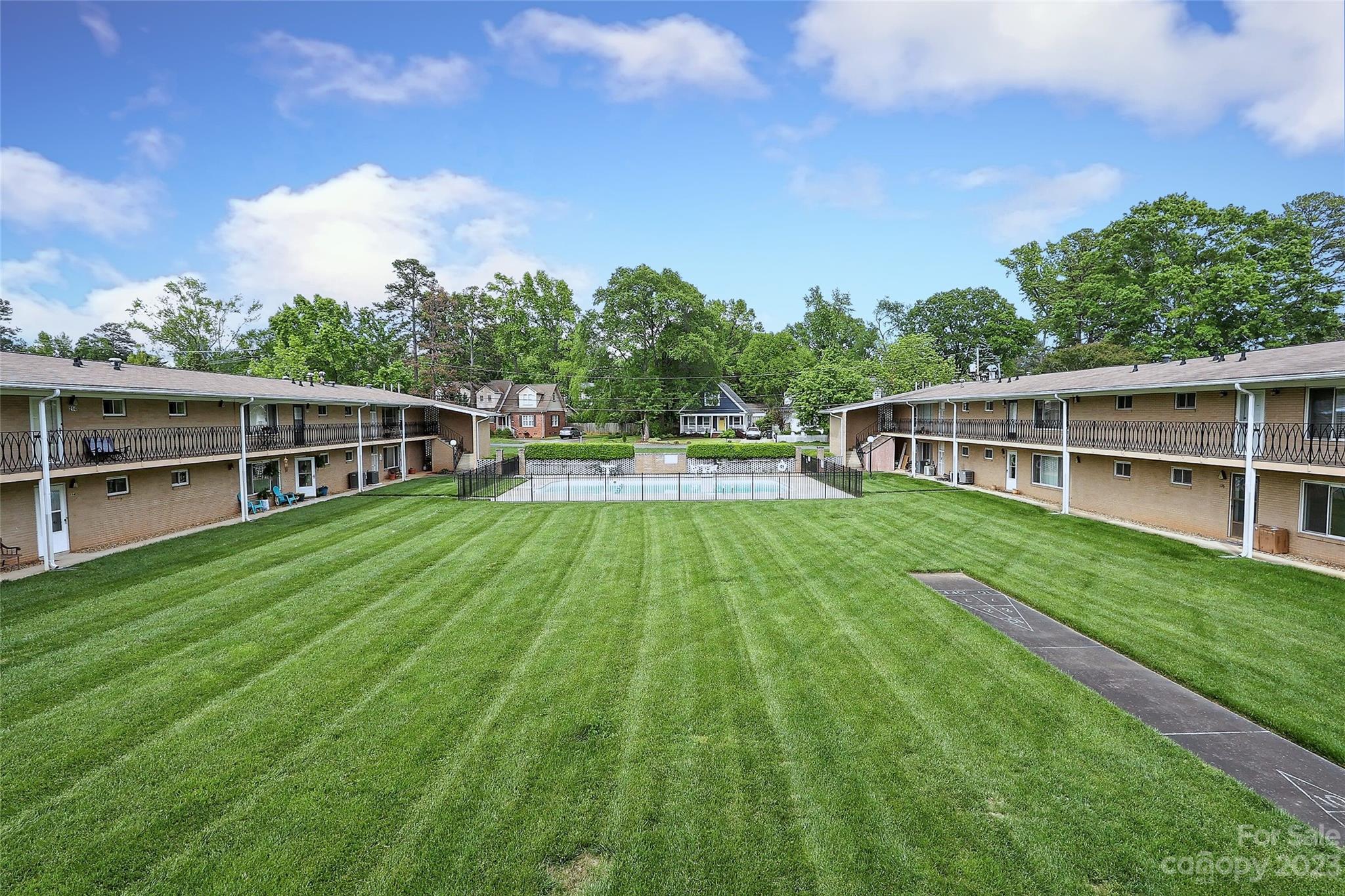 3010 Crosby Road, Unit 220 Charlotte, NC 28211 - Photo 2 of 39 a view of house with backyard outdoor seating and entertaining space