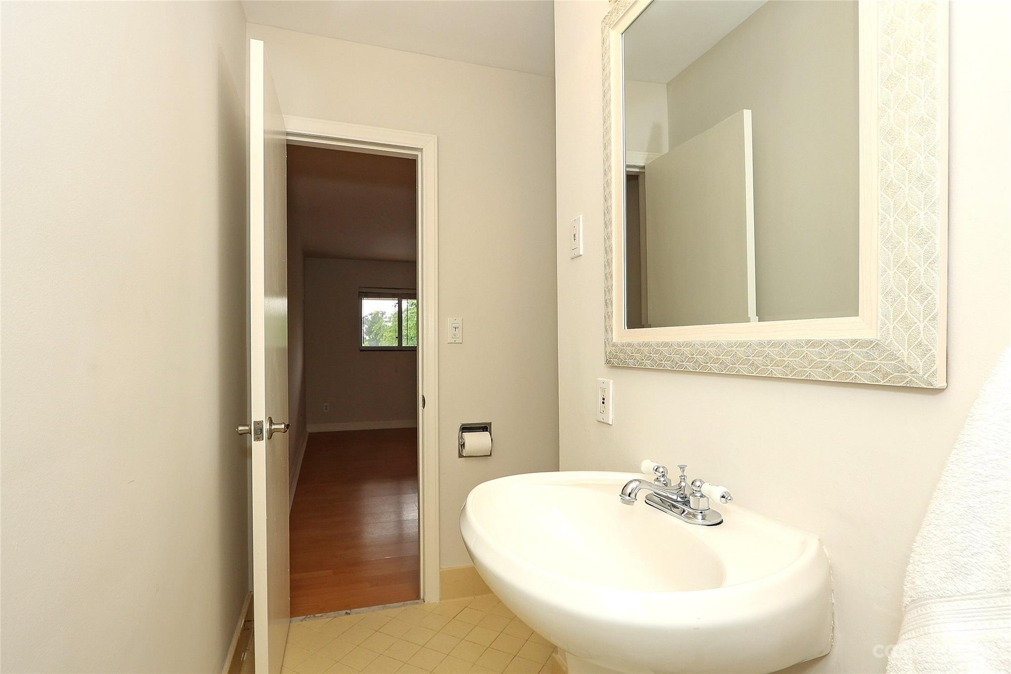 3010 Crosby Road, Unit 220 Charlotte, NC 28211 - Photo 25 of 39 a bathroom with a sink and a mirror