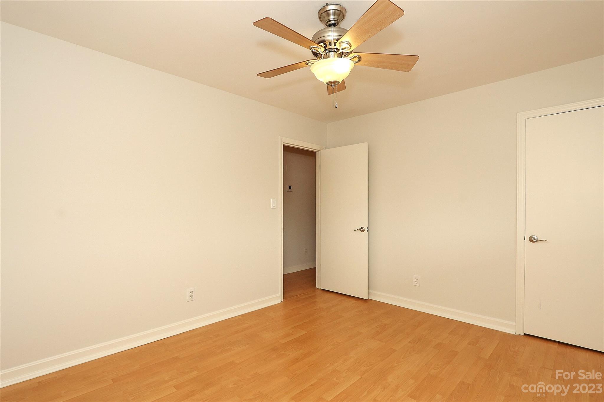 3010 Crosby Road, Unit 220 Charlotte, NC 28211 - Photo 28 of 39 an empty room with a ceiling fan and a window