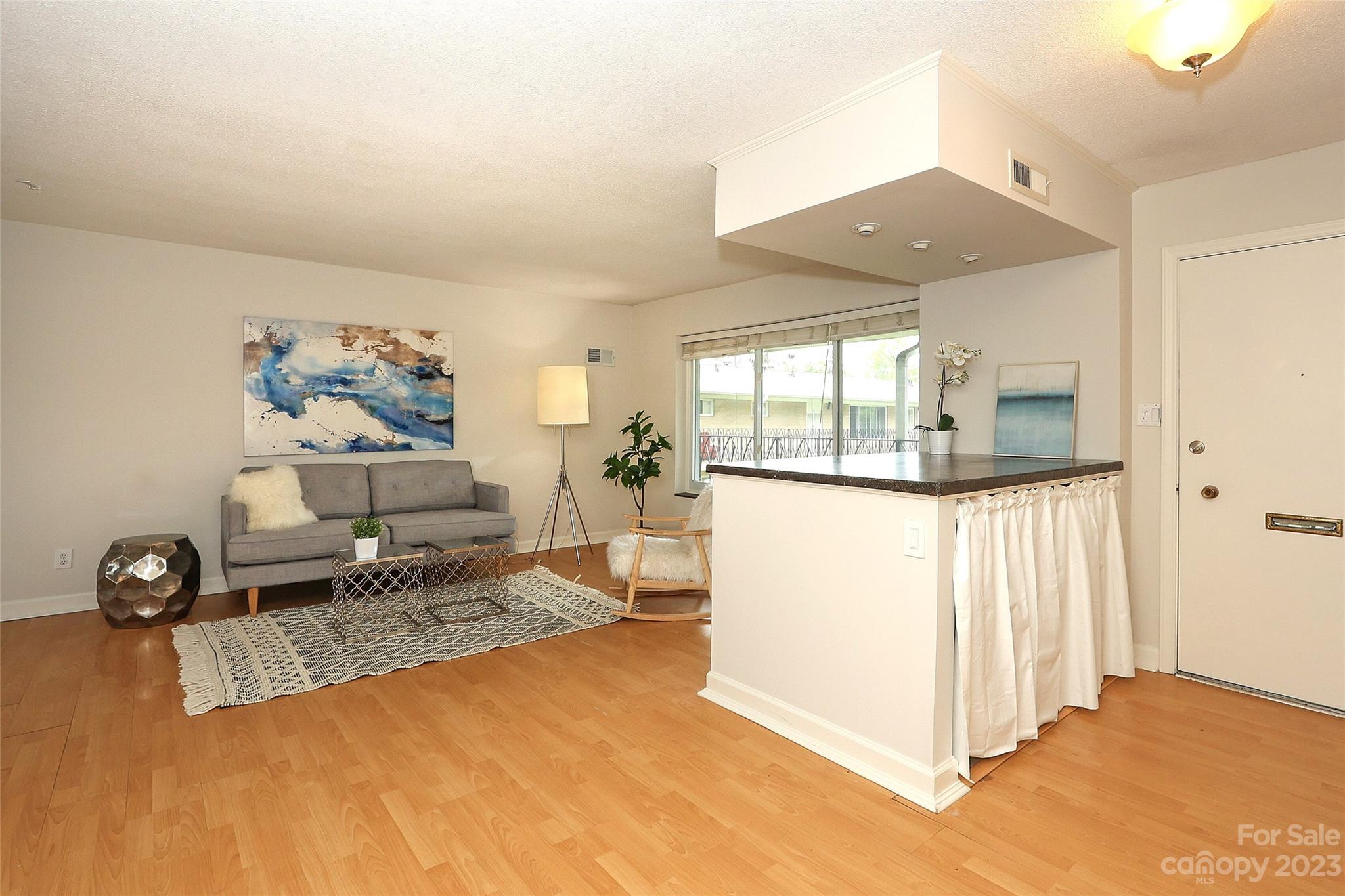3010 Crosby Road, Unit 220 Charlotte, NC 28211 - Photo 4 of 39 a view of living room filled with furniture and white walls