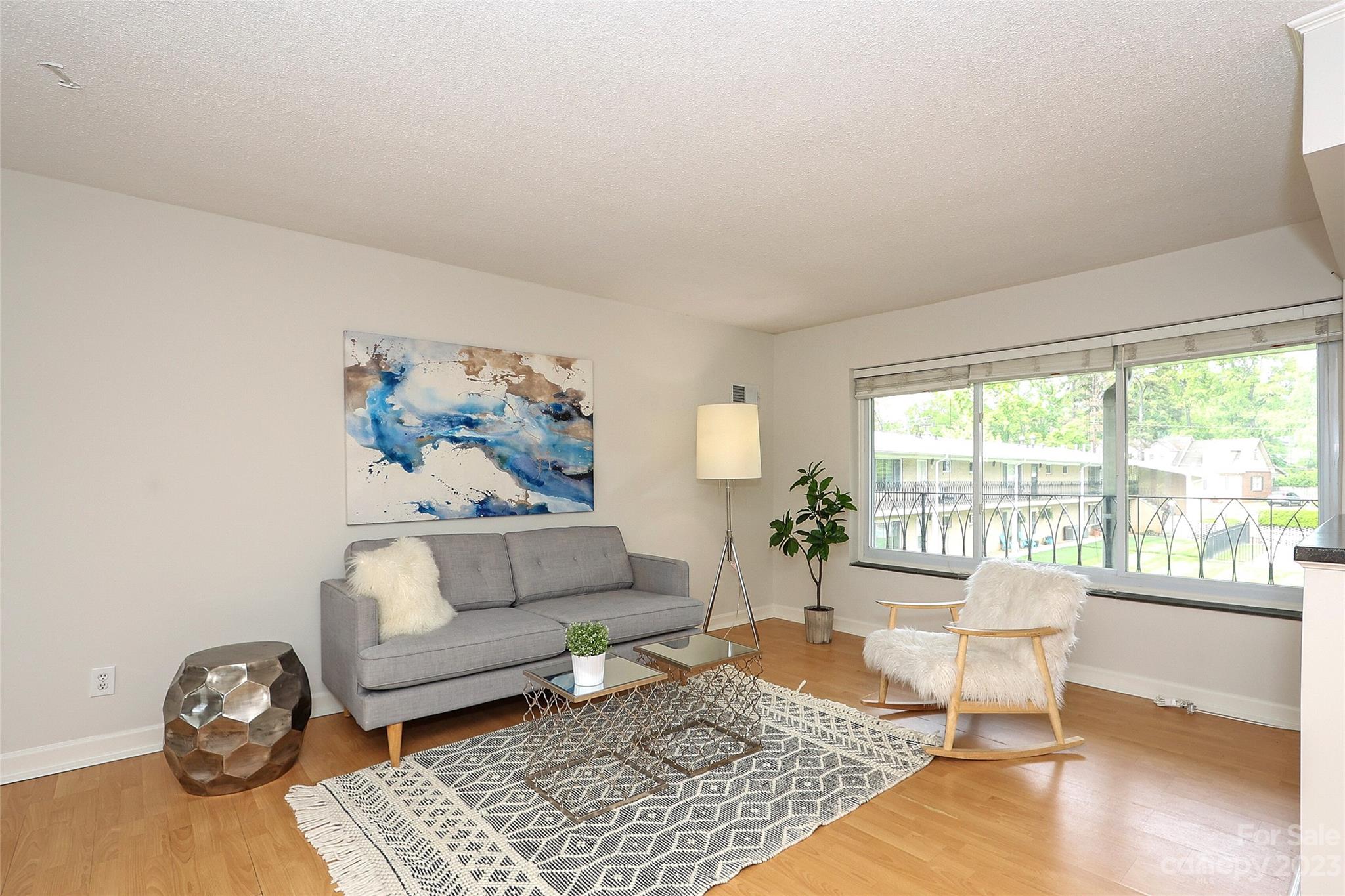 3010 Crosby Road, Unit 220 Charlotte, NC 28211 - Photo 6 of 39 a living room with furniture and a rug