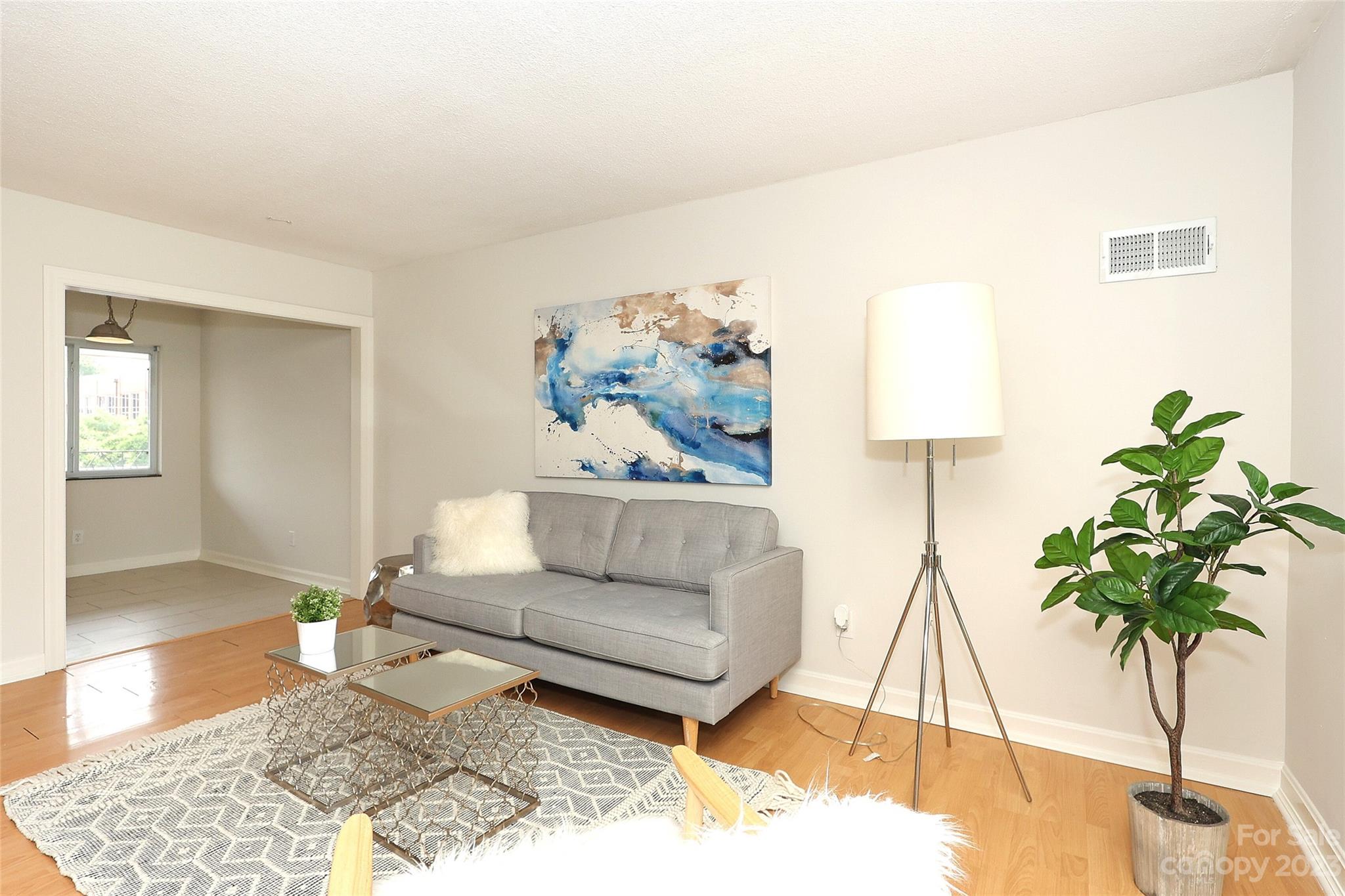 3010 Crosby Road, Unit 220 Charlotte, NC 28211 - Photo 10 of 39 a living room with furniture and a potted plant