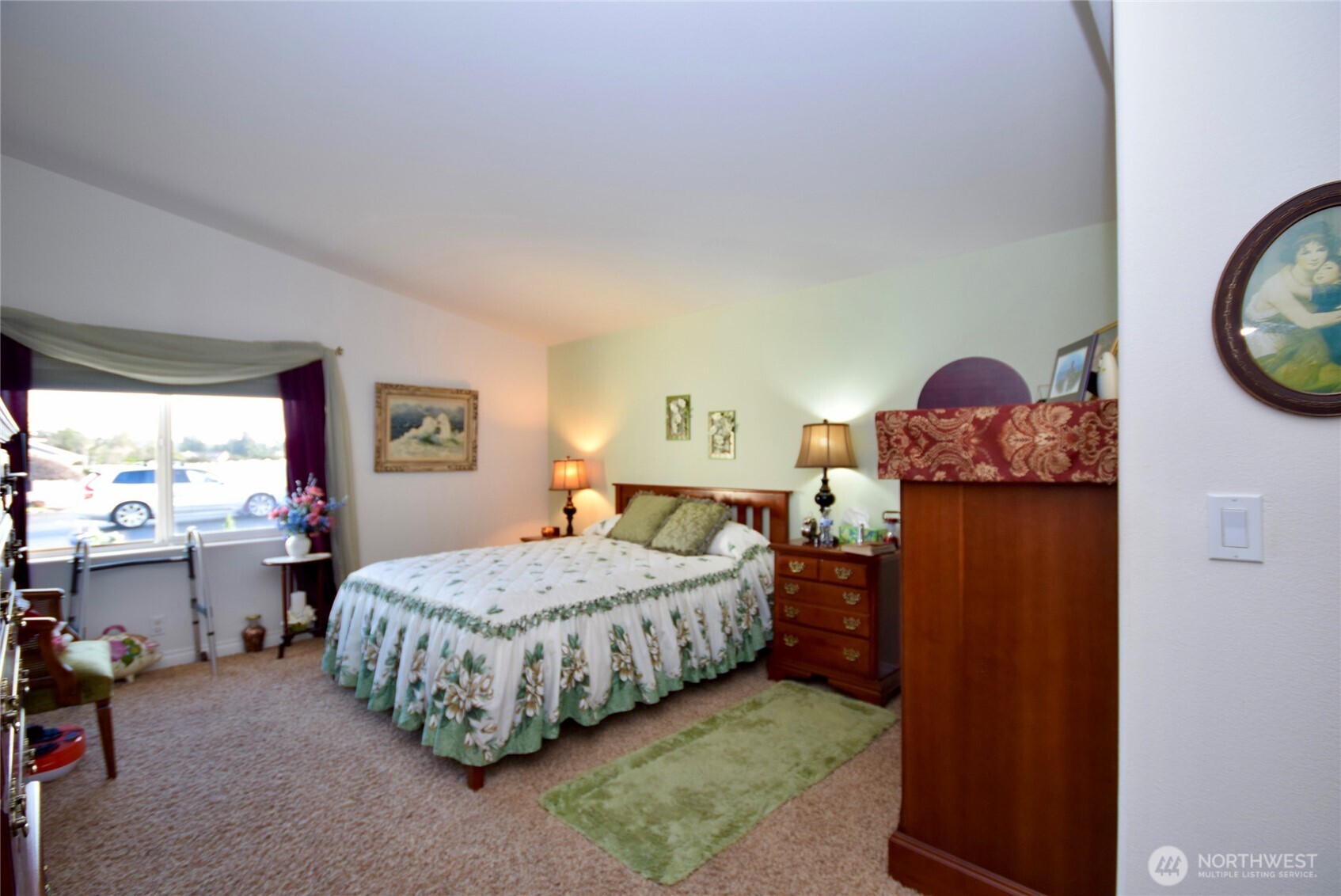 891 North Portside Way Sequim, WA 98382 - Photo 11 of 18 a bedroom with a bed and dresser