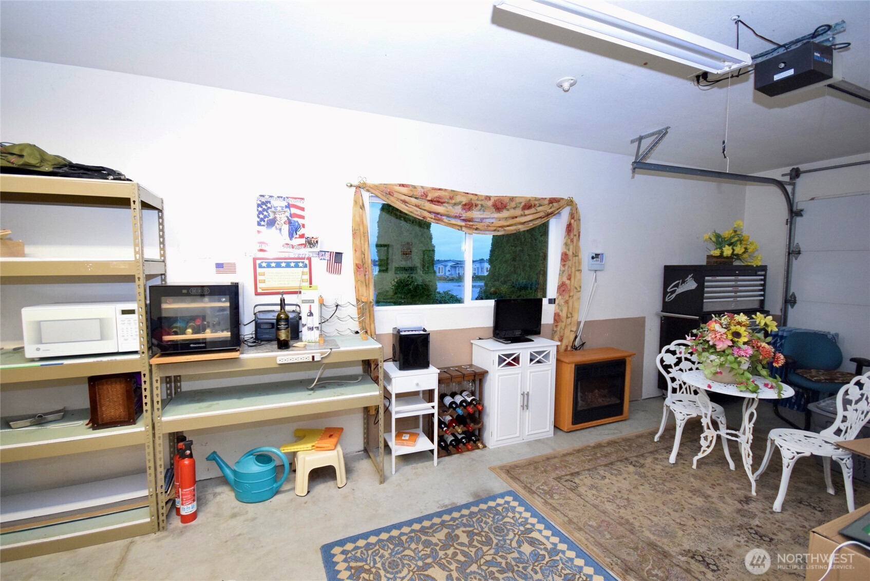 891 North Portside Way Sequim, WA 98382 - Photo 15 of 18 a living room with furniture a flat screen tv and a table